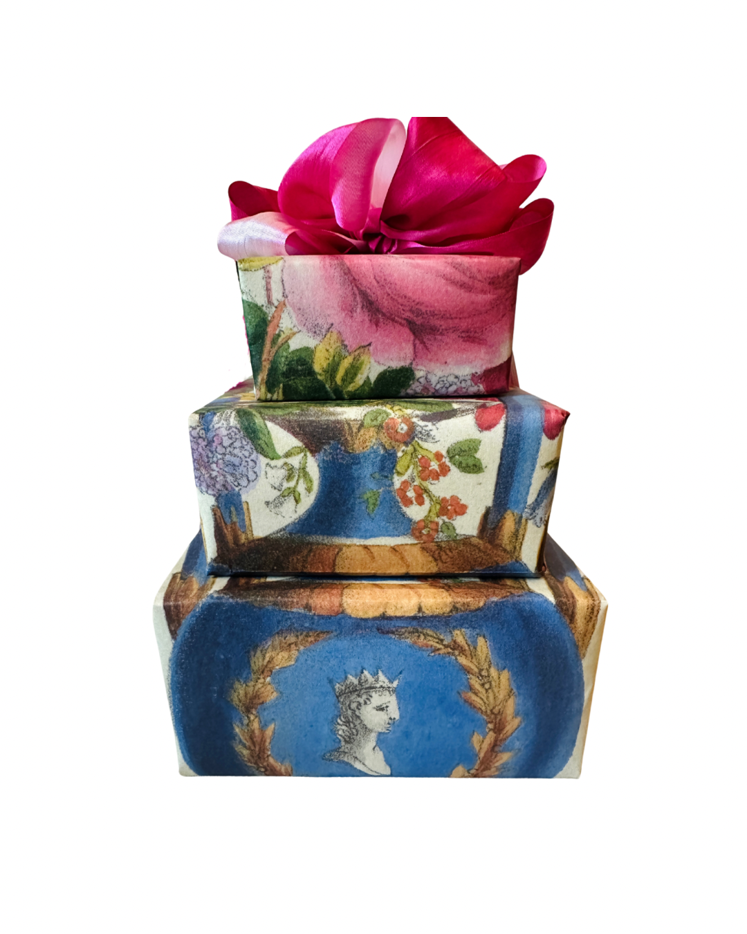 Stack of three presents wrapped in gorgeous antique inspired gift wrap wrapping paper by Caldwell’s Miscellaneous Fancy Goods