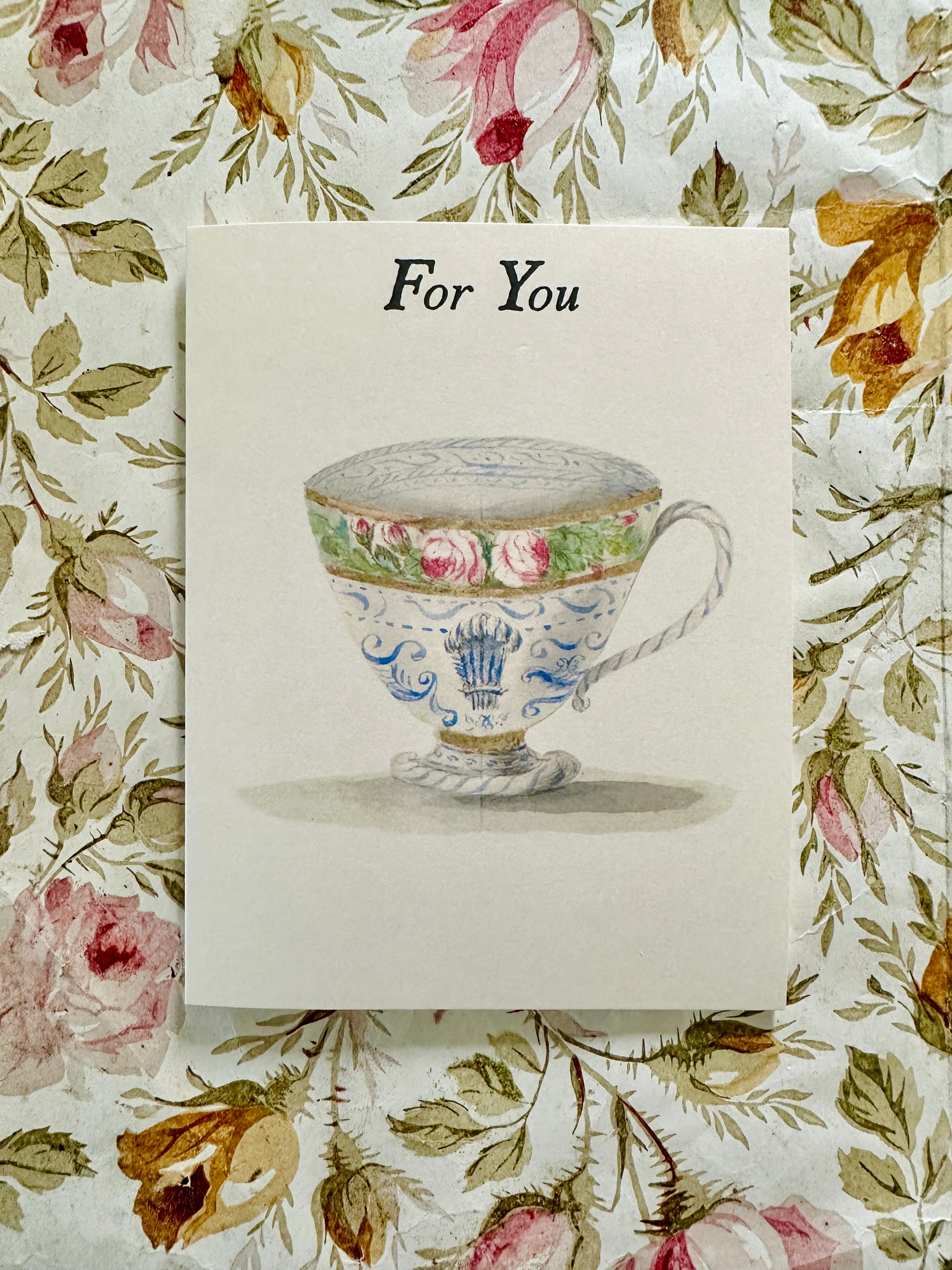 For You Teacup card with watercolor teacup illustration displayed against a coordinating antique floral backdrop, by Caldwell's Miscellaneous Fancy Goods.