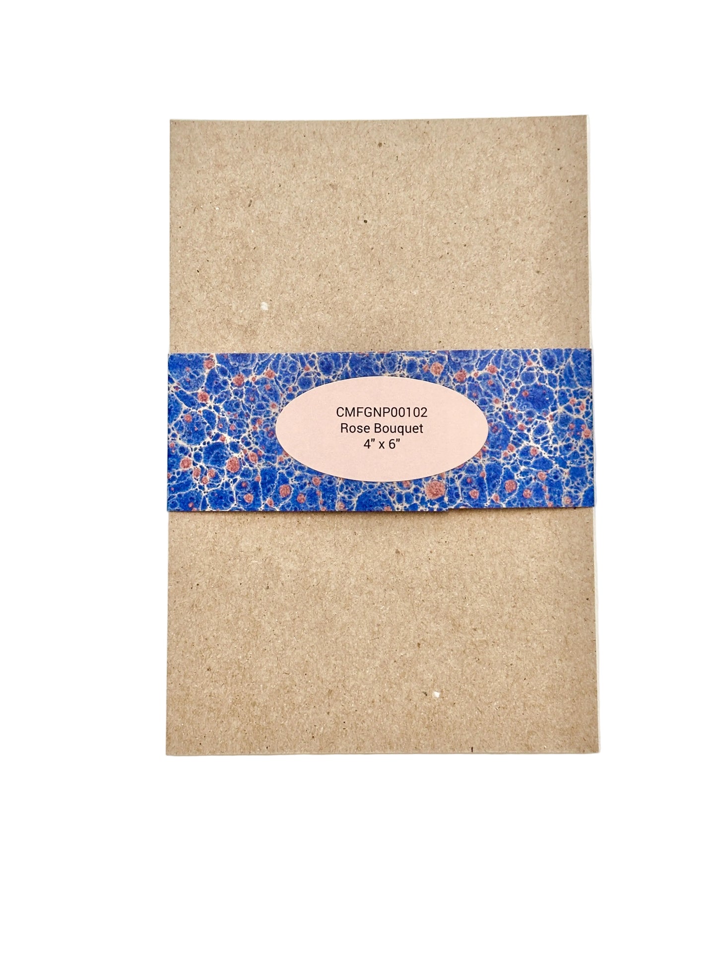 A chipboard notepad back wrapped with a blue and pink marbled paper band and a pale pink oval label 